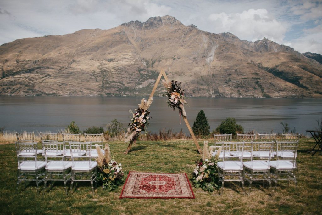 Floral arch and chairs ceremony setup