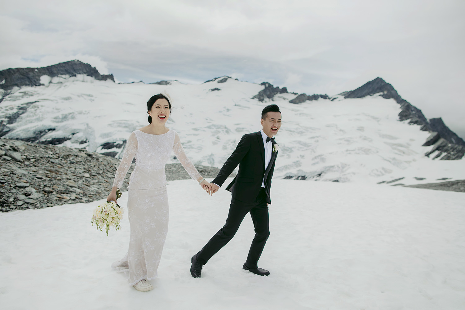 Couple in snow by glacier