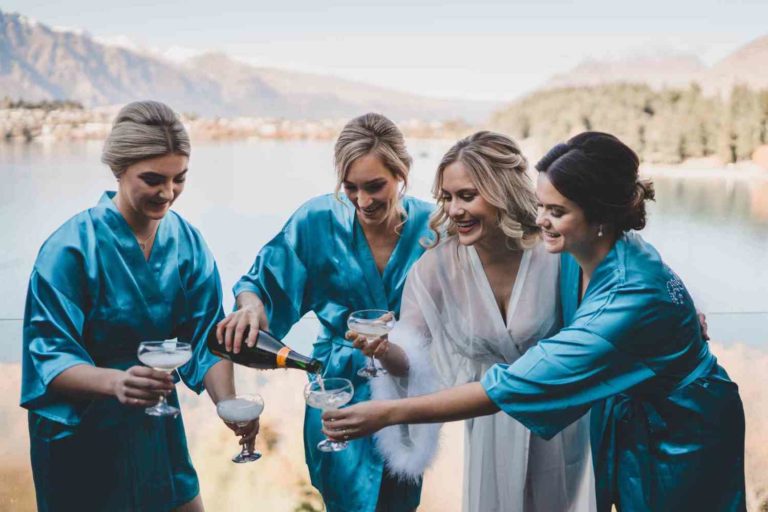 Pouring champagine for the bride and her bridesmaids