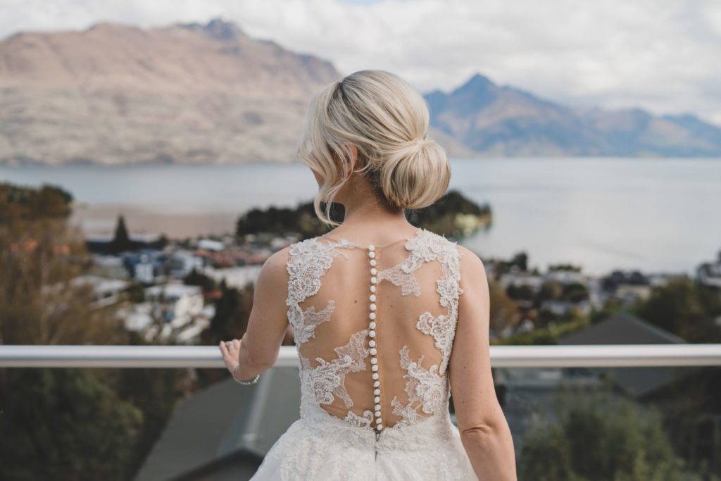 Williams Photography Bride in Dress on Balcony